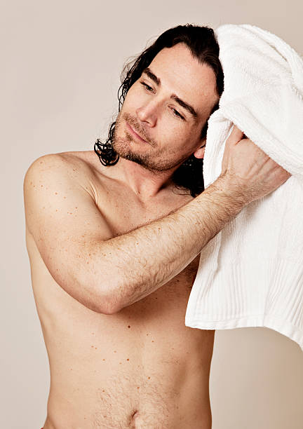 istock Shirtless man drying his hair 97506669