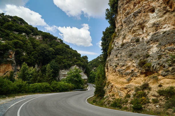 istock Asphalt road in a rocky ravine 975066914