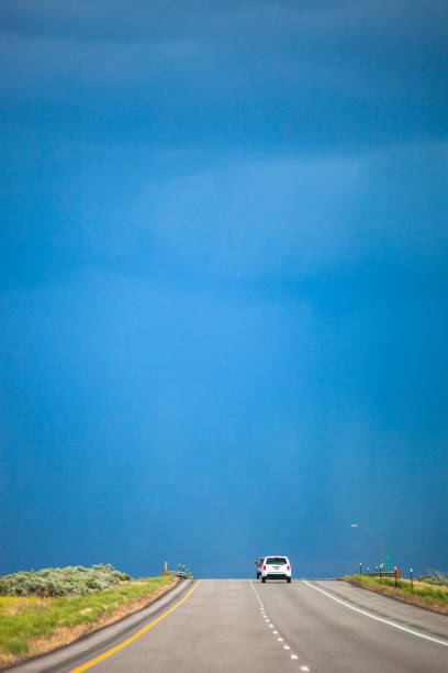 Car traffic on interstate through plains in Idaho.