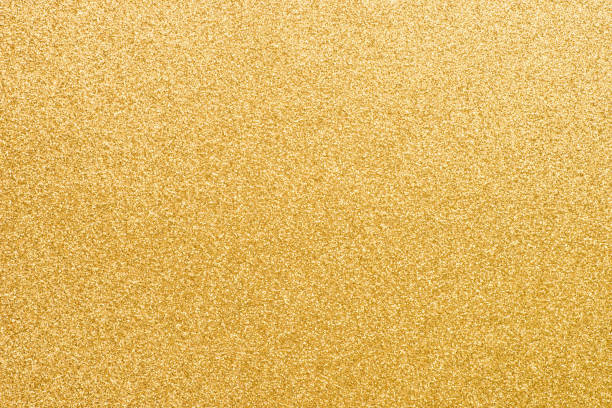 golden glittering paper background texture - purpurina imagens e fotografias de stock
