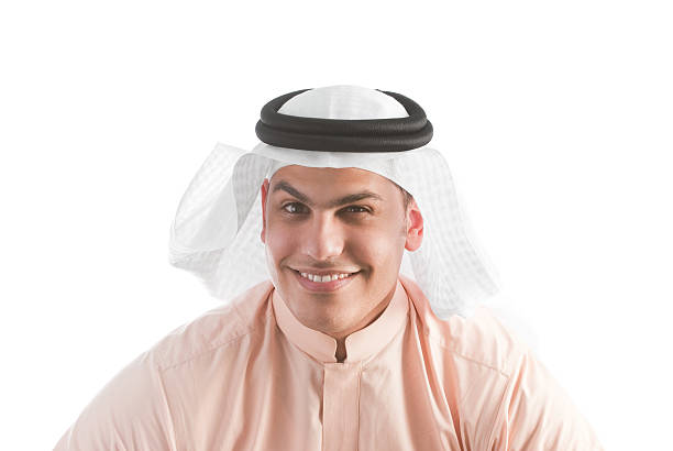 Asian Muslim man wearing Arab turban sorban excited face expression looking at watch in copy space