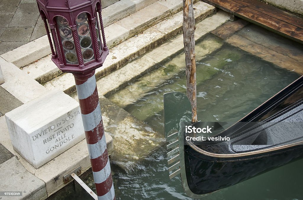 Venice parking Detail of a Gondola's parking space along a canal in Venice, Italy. Gondola - Traditional Boat Stock Photo