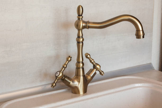istock Vintage retro bronze water tap faucet 975105982