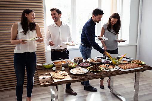 Friends Eating Healthy Food Served For Party