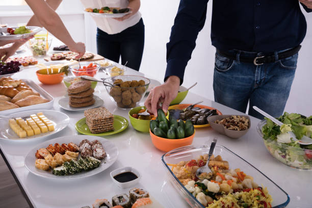 istock People Picking Food At Party 975118468
