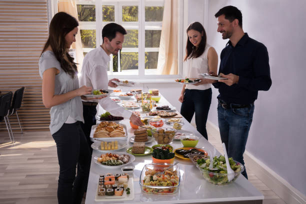 istock Young Friends Eating Delicious Food 975118510