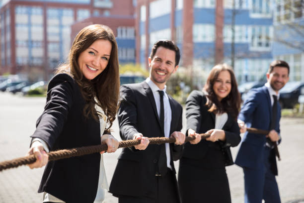 istock Businesspeople Playing Tug Of War 975121246