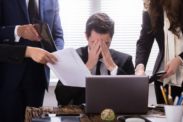 istock Stressed Businessman Sitting In Office 975122120