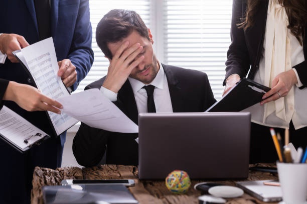 istock Stressed Businessman Sitting In Office 975122136