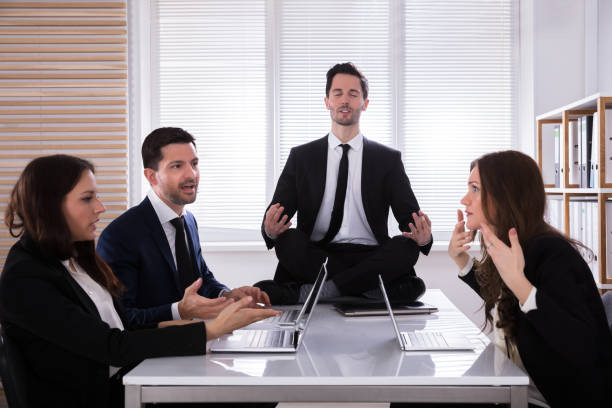 istock Businessman Meditating In Office 975122830