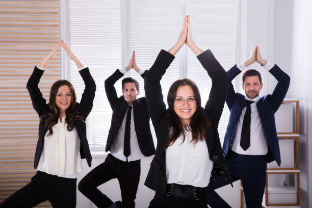 istock Businesspeople Doing Yoga 975123222
