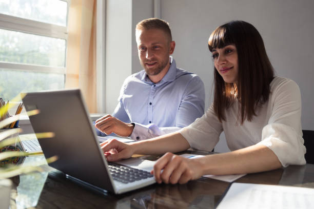 istock Two Businesspeople Working In Office 975124098