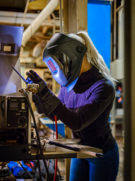 istock Female TIG Welder 975125088