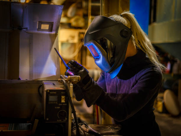 istock Female TIG Welder 975125292