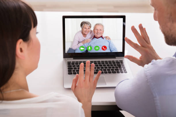 istock Couple Video Conferencing On Laptop 975131472