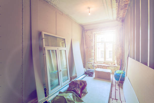 istock Working process of installing pvc windows and metal frames for plasterboard  -drywall - for making gypsum walls in room of apartment is under construction, remodeling, renovation, extension, restoration. overhaul and reconstruction 975134530