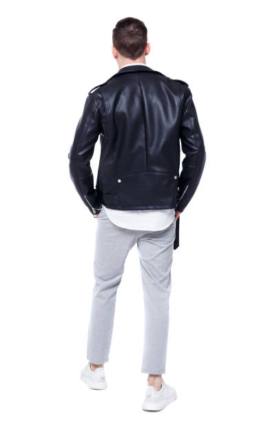 istock Back view of a stylish man in a leather jacket 975148882