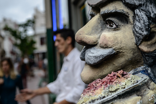 Buenos Aires, Argentina - February 05, 2017: Caricatured doll and waiter are seen in front of a restaurant in San Telmo, traditional neighborhood of the Argentine capital, Buenos Aires.