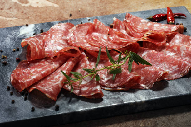 istock thinly sliced salami . delicious snack rustic salami 975186616