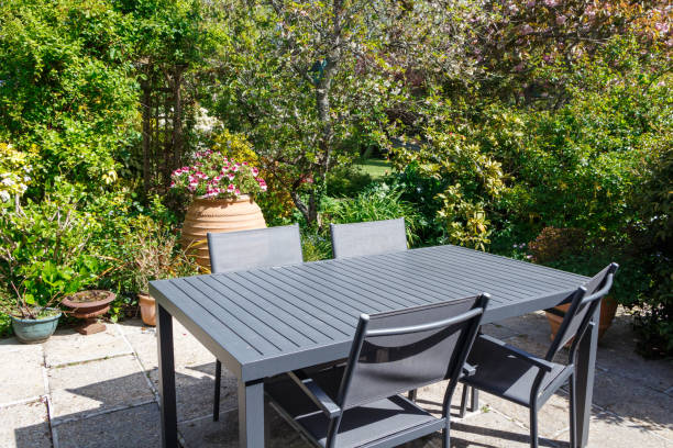 istock Flowered terrace with garden furniture 975193100