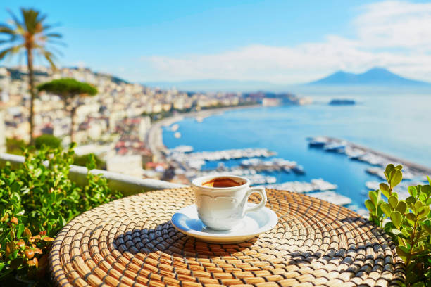 istock Cup of coffee with view on Vesuvius mount in Naples 975196246