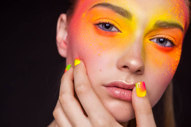 istock Creative make-up of colored powder closeup. Colored nail design. Studio 975198046