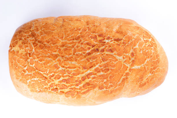 istock Bread isolated on white background, wheat freshly baked bread close up, preparation for the designer, crispy golden crust, tasty food, European cuisine 975200446