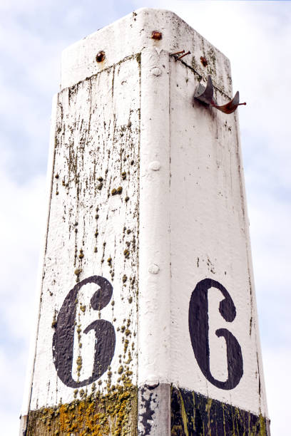 istock Mooring post with number six painted on each side 975204640