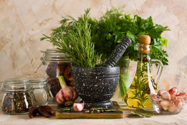 istock Marble mortar and pestles with herbs garlic and pepper 975205058