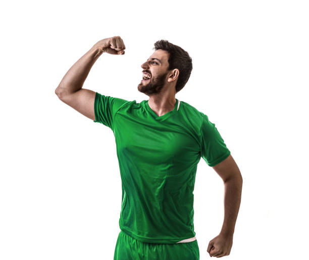 istock Fan / Sport Player on green uniform celebrating on white background 975205710