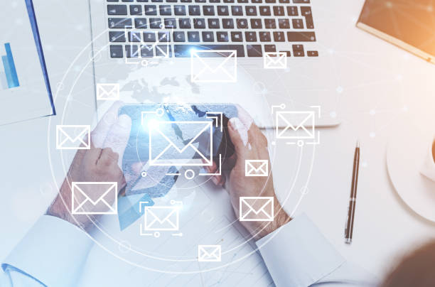 istock Businessman with a smartphone, office email 975216474