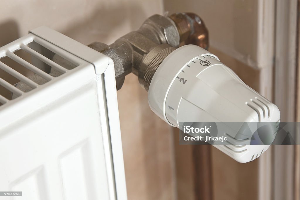 Heating radiator with regulator  Climate Stock Photo