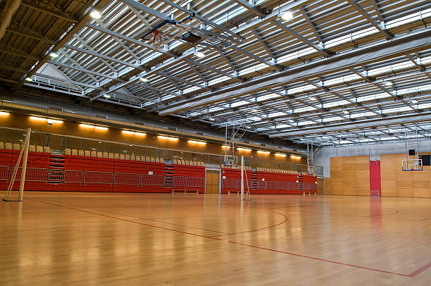 istock Big Empty Sports Hall Red Metal Roof 97522087
