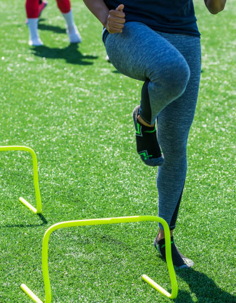 istock Front view of running over mini hurdles 975221666