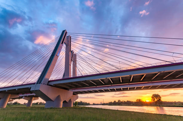 istock Cable stayed bridge over Vistula river, Krakow, Poland, beautiful colorful sunset 975226036