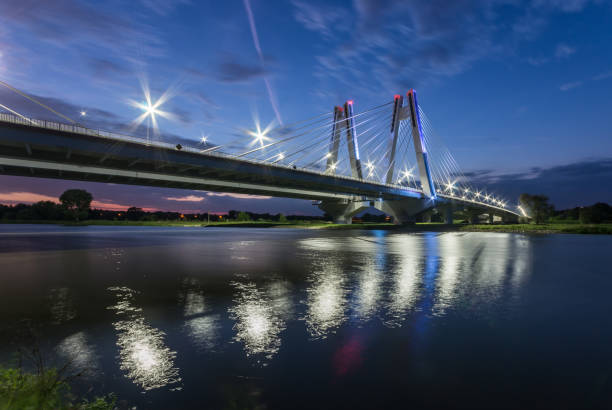 istock modern bridge over Vistula river, Krakow, Poland, illuminated in the night 975226140
