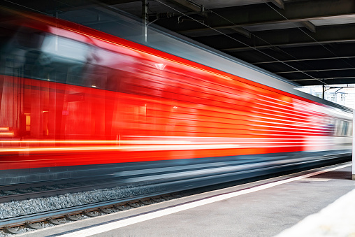 Speeding train through a European Station