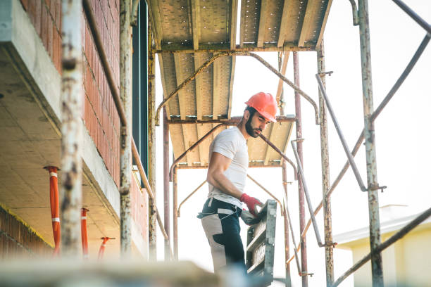 Worker Stand On Scaffolding While Building The Foundation stock photo