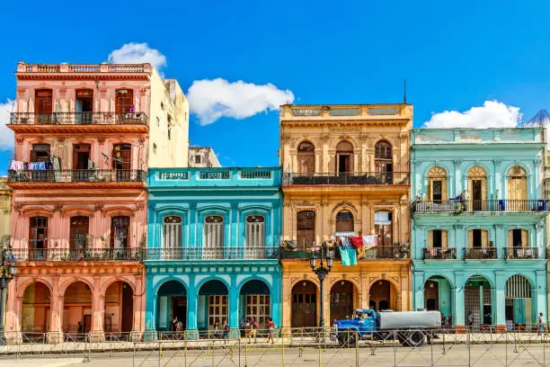 Old living colorful houses across the road in the center of Havana, Cuba
