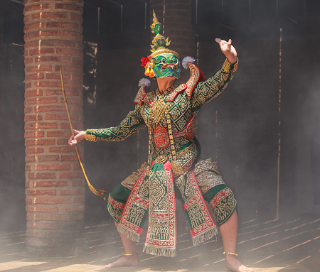 Thotsakan (ten faces giant) in Khon or Traditional Thai Pantomime as a cultural dancing arts performance in masks dressed based on the characters in Ramakien or Ramayana Literature.