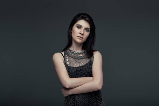 istock Portrait brunette attractive woman, accent on arms 975246044
