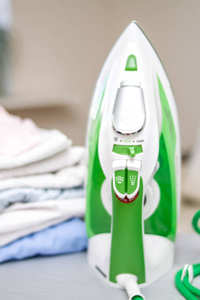 istock iron and pile of clothes 975250786
