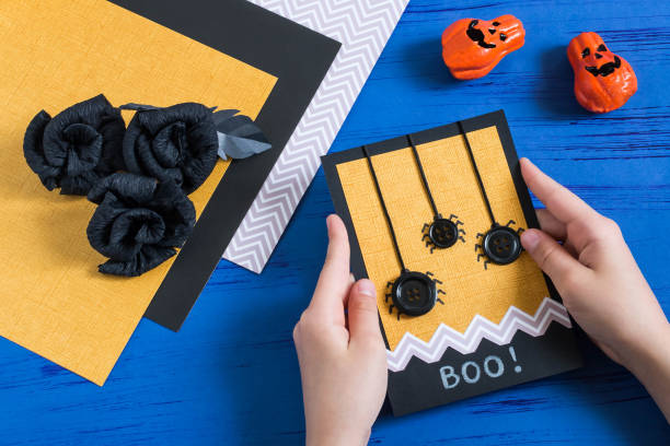 istock Child makes card to Halloween. Step 8 975294936