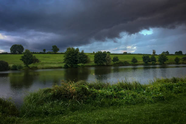 istock Lake with trees in the sunset 975297266