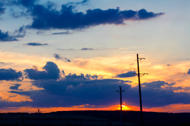 istock electric poles in the evening 975306156