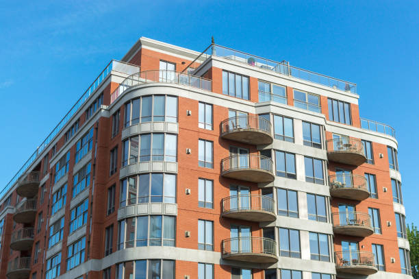 istock Modern condo buildings with huge windows and balconies 975316926