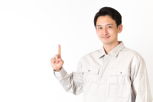 portrait of young asian engineer isolated on white background