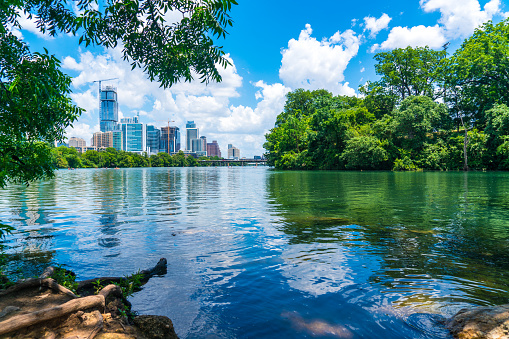Lou Neff Point Blue Summer travel destination Austin Texas growing downtown skyline cityscape aerial drone view in the capital city in central Texas hill country reflections off Town Lake or Colorado River View from the end of Zilker Park