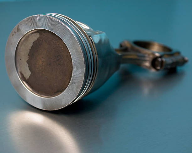 Corroded engine piston and connecting rod stock photo