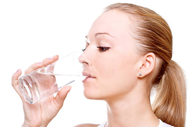 istock beautiful woman drinking water 97534980